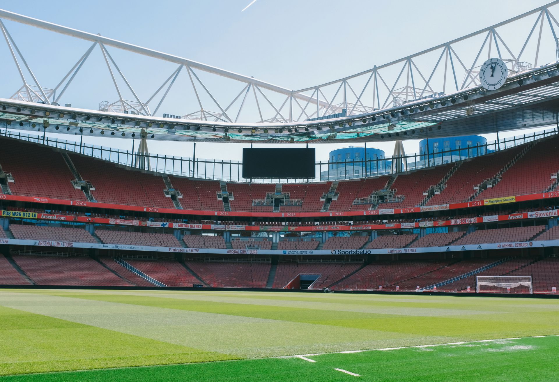 A football pitch surrounded by stadium seating